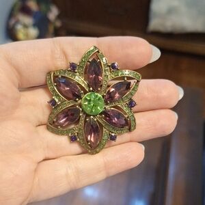 Elegant Floral Brooch with Green and Purple Accents